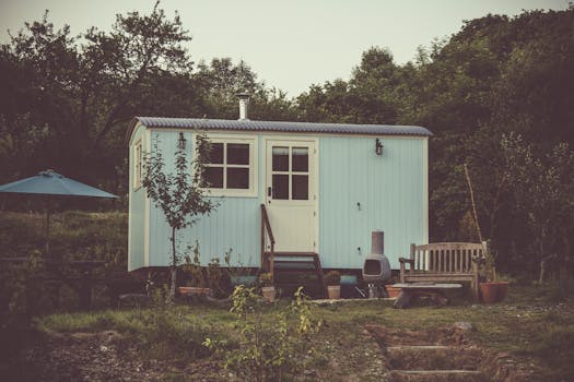 a cozy tiny home in a green landscape