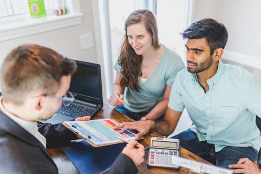 a financial planner discussing options with a couple