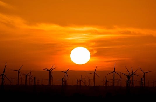 a tiny house with solar panels and a wind turbine